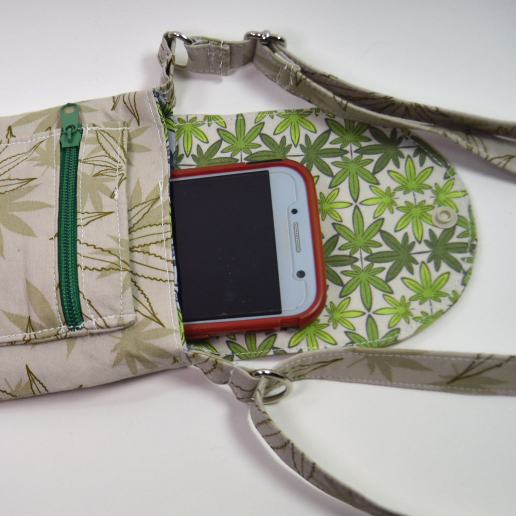 Fabric-wrapped phone with green leaf pattern on a white background