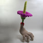 Severed Hand with a Corpse Flower